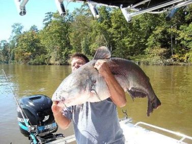 Capt Archie holding a huge catfish