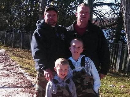 U.S. Army Sgt. Rick Warren and Sons Christopher and Wesley October 26, 2013